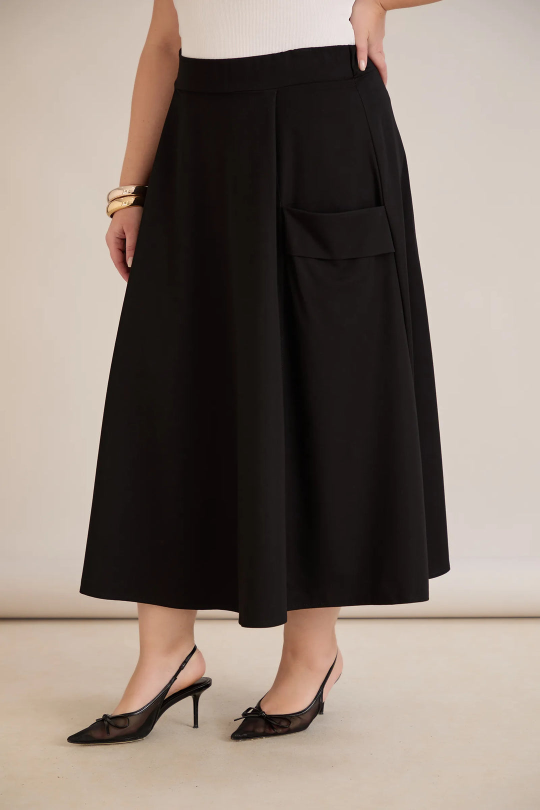 Sportsko-elegantna midi suknja s džepovima