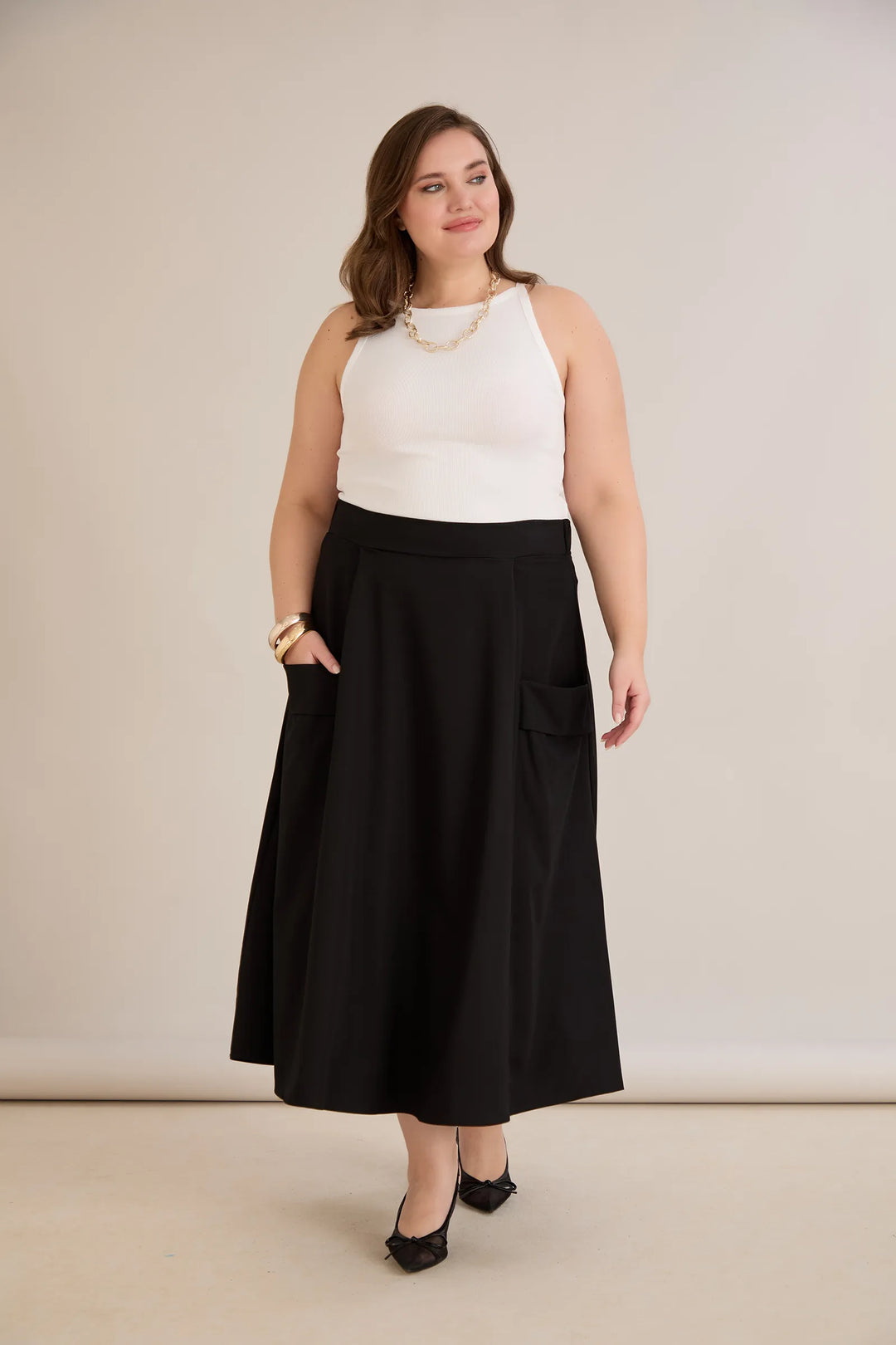 Sportsko-elegantna midi suknja s džepovima