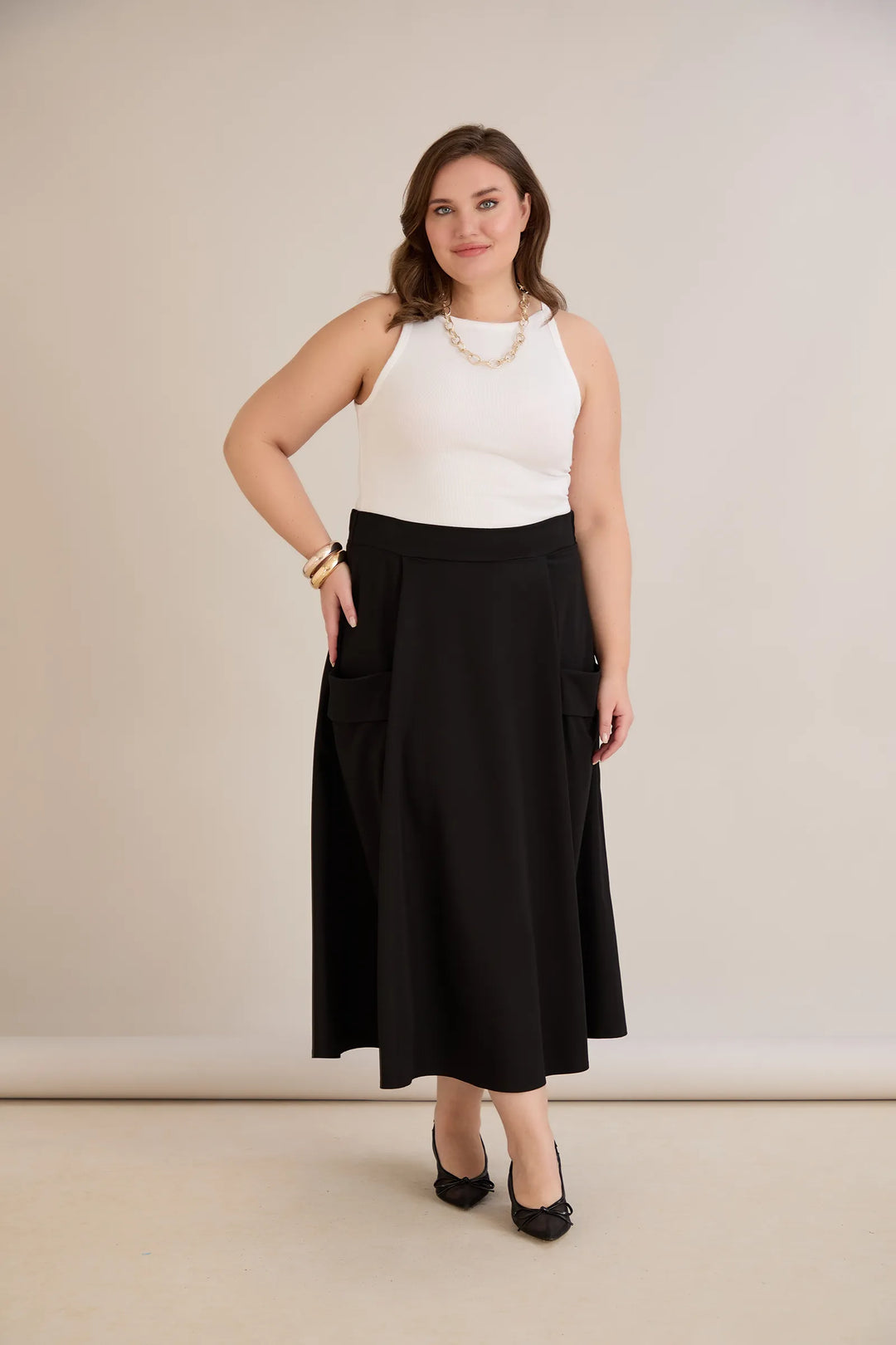 Sportsko-elegantna midi suknja s džepovima