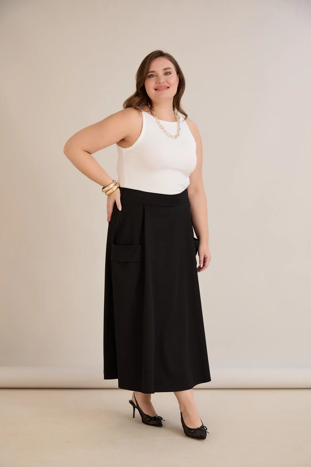 Sportsko-elegantna midi suknja s džepovima