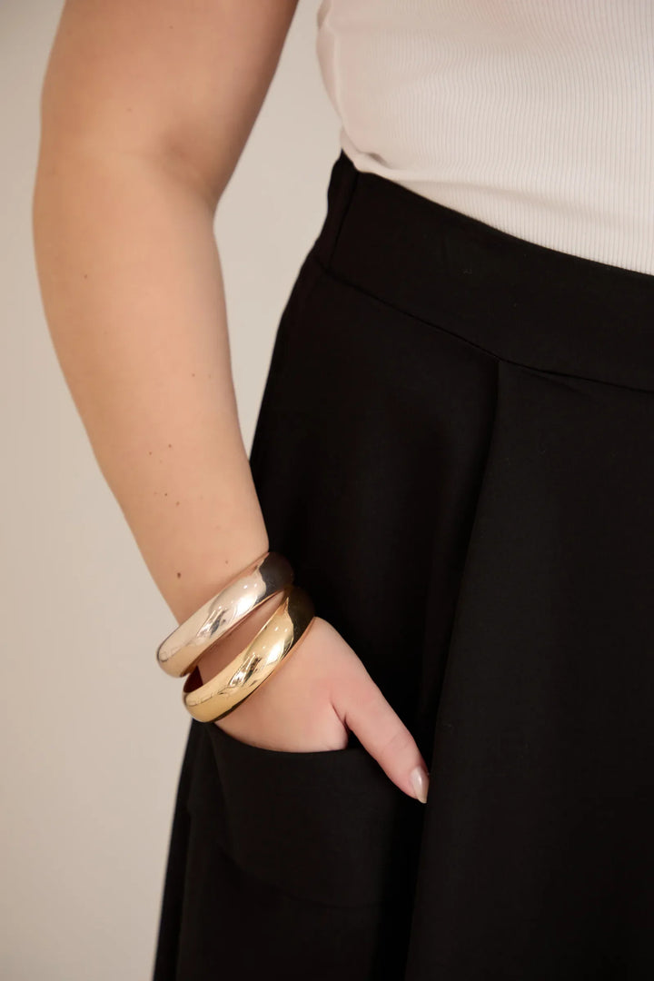 Sportsko-elegantna midi suknja s džepovima